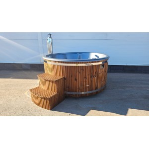 Round fiberglass hot tub with integrated heater