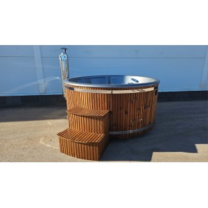 Round fiberglass hot tub with integrated heater