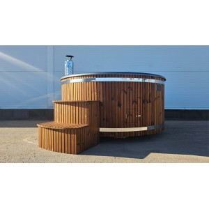 Round fiberglass hot tub with integrated heater