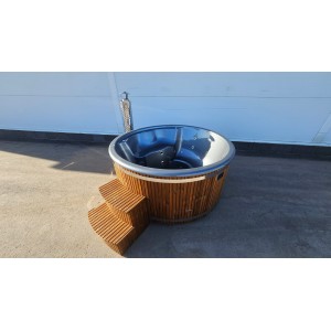 Round fiberglass hot tub with integrated heater