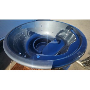 Round fiberglass hot tub with integrated heater